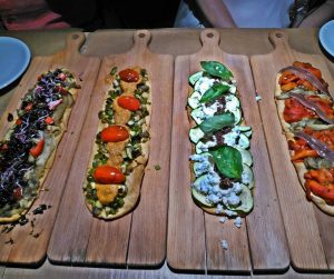 coca flatbreads with vegetables and anchovy