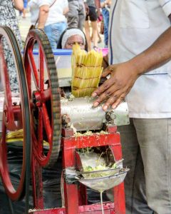 a man makes sugar cane juice in havana cuba