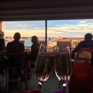 a couple drinks prosecco on the rooftop bar at the hilton venice italy