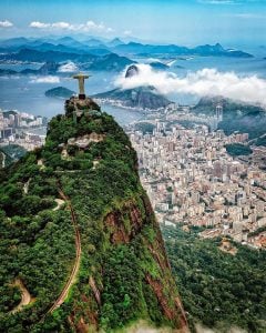 an aerial shot of rio de janeiro with christ the redeemer