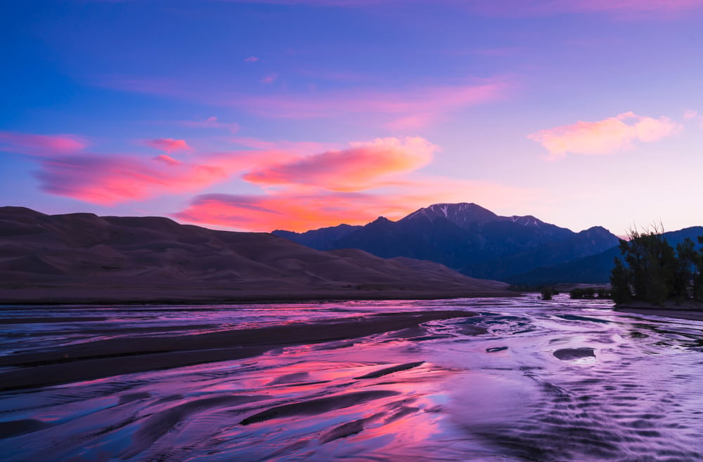 Great,Sand,Dune,National,Park,At,Sunrise,With,River,Foreground,colorado,usa.