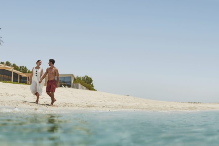 couple walking at the beach